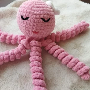Pieuvre de naissance rose sur couverture étoilée